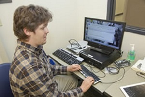 VRCBVI instructor using a refreshable Braille display to read the computer screen